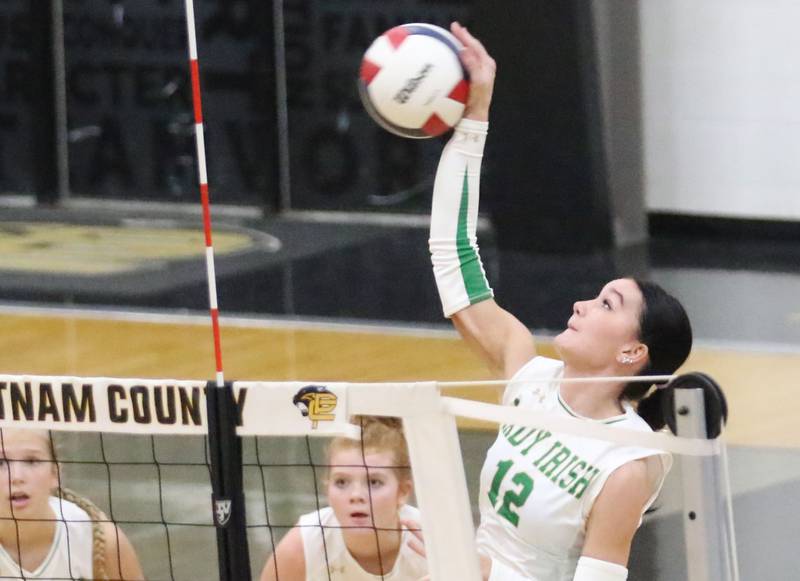 Seneca's Lexie Buis spikes the ball to the Henry-Senachwine side of the net during the Tri-County Conference championship game on Thursday, Oct. 16, 2025 at Putnam County High School.