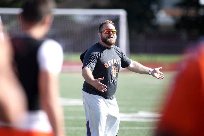 DeKalb Head Coach Keith Snyder talks to his team during the West Aurora 7-on-7 football tournament on July 12, 2019.