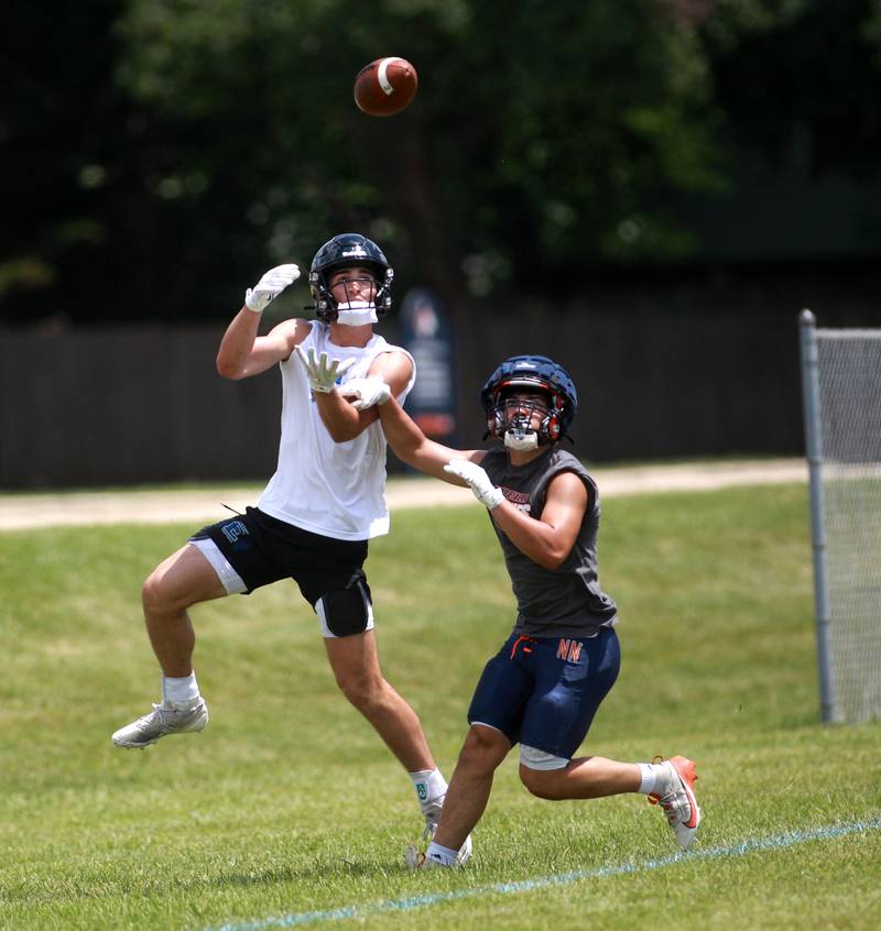 Lincoln-Way East’s Blaise LaVista (left) goes up for the catch during a 7 on 7 tournament on Thursday, June 26, 2025 at Naperville North.