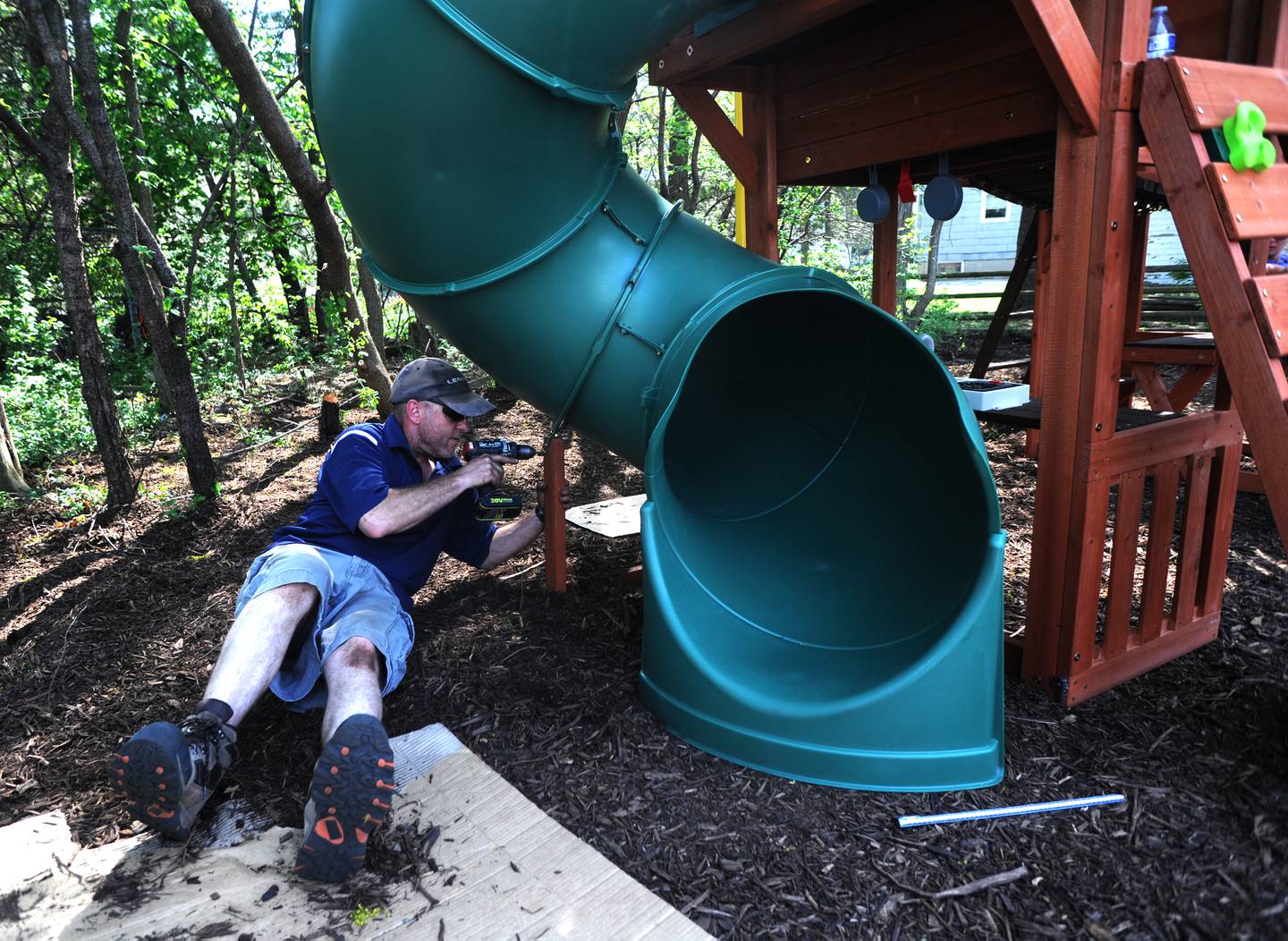 James Chamber of Lennar works on building a playhouse Friday, May 13, 2022, at Kids in Need of McHenry County home, 55 E. Crystal Lake Ave. in Crystal Lake. About 70 employees of Lennar and their trade partners spent the day working on the home which is used for foster kids to interact with their biological parents in a more comfortable and natural setting.