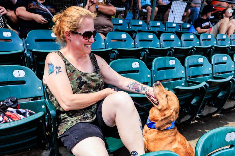 Ozzy enjoys some pets from Kim Jenkovsky during the Joliet Slammers Dog Day event, presented by University of St. Francis, on Aug. 10, 2025.