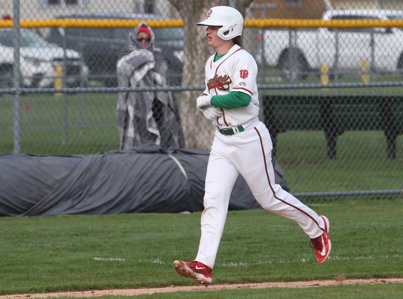 L-P's Billy Mini runs to home after hitting a home run against Kaneland on Wednesday, April 5, 2023 at Dickinson Field in Oglesby.