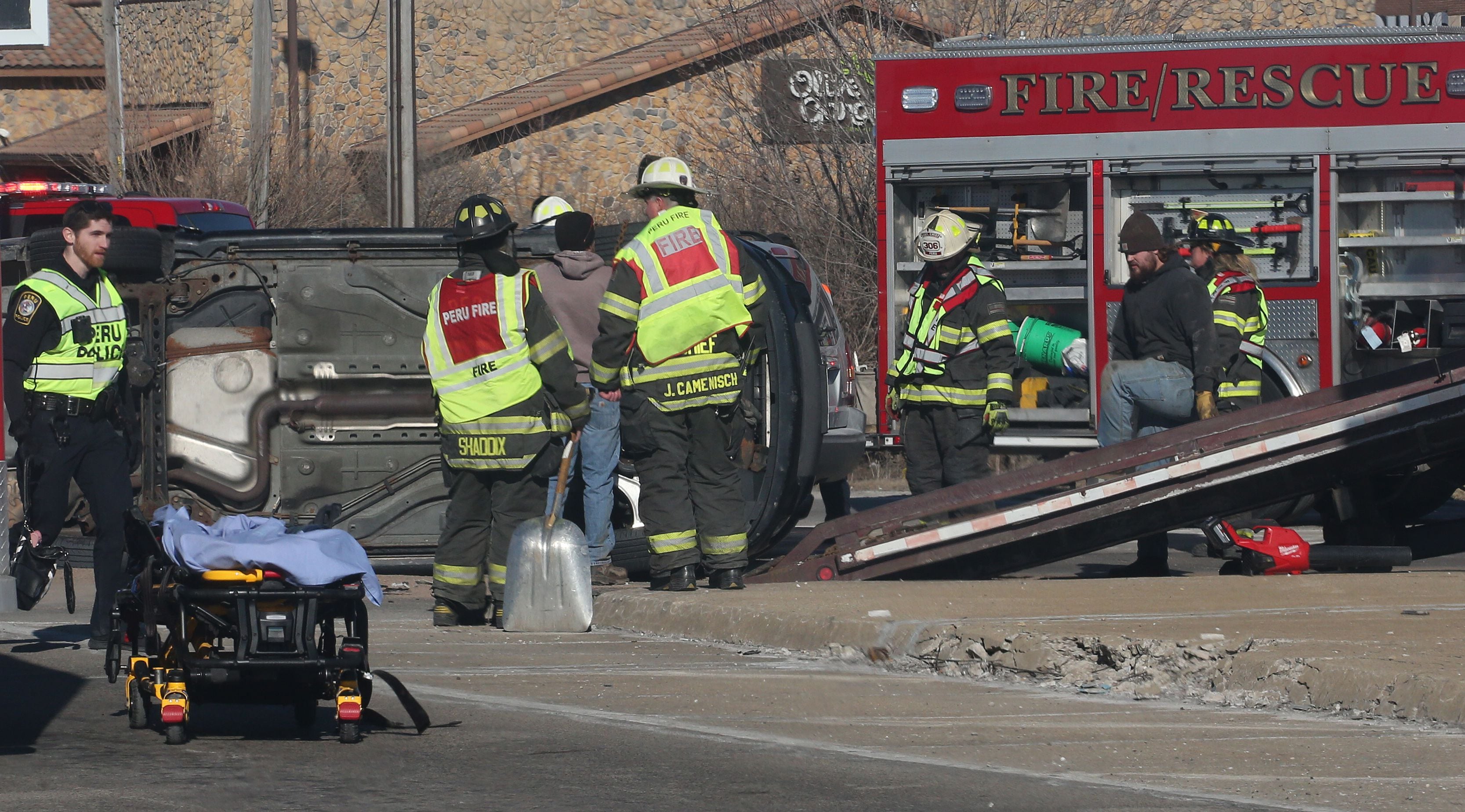 Peru firefighters and paramedics work the scene of a multiple vehicle crash at the intersection of Illinois Route 251 and May Road on Monday, Jan. 27, 2025 in Peru. The crash happened around 12:45p.m. Ambulances from Peru, La Salle, Mendota Spring Valley, and Oglesby responded to the scene to transport multiple victims to area hospitals.