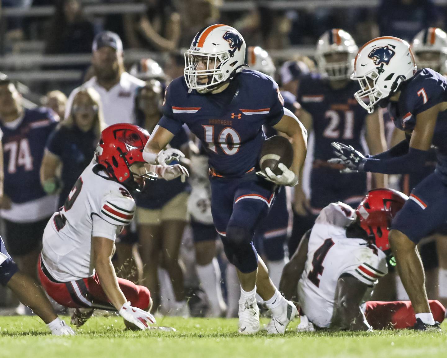 Oswego's Mariano Velasco (10) runs back an interception during football game between Bolingbrook at Oswego Friday, Sept 12, 2025  in Oswego.
