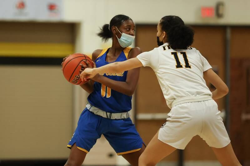 Joliet Central’s Karyssa Stewart looks for a play against Joliet West. Tuesday, Feb. 8, 2022, in Joliet.