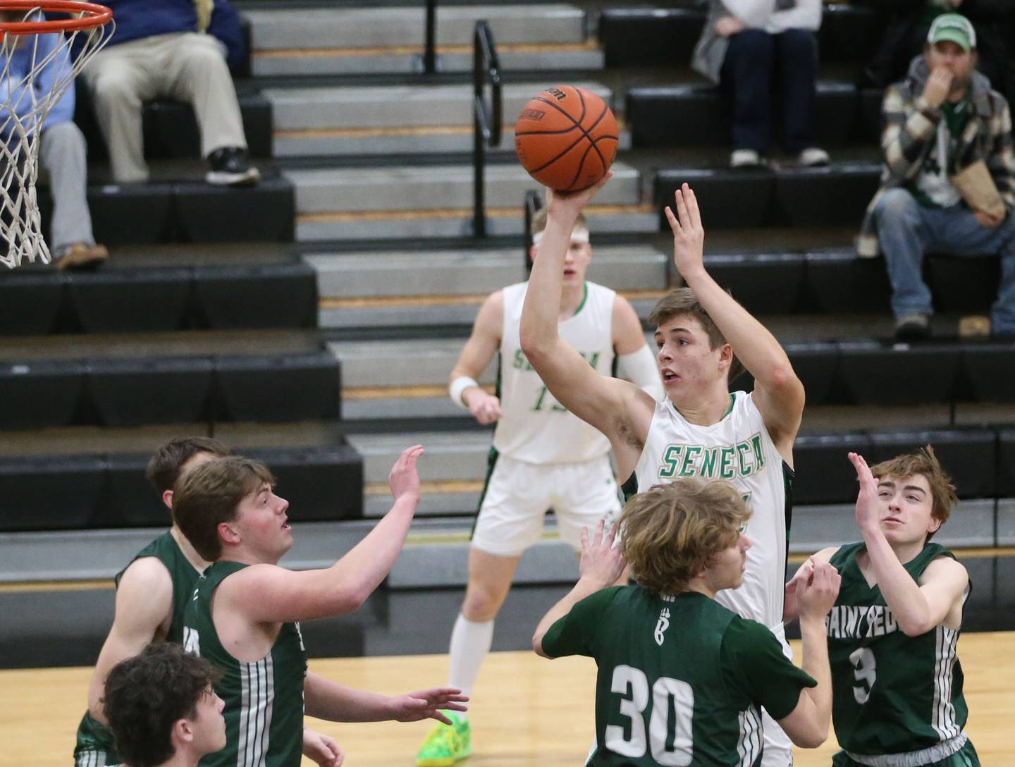 Seneca's Lane Provance eyes the hoop as St. Bede players Jake Miglorini, Kaden Newman and Alex Ankiewicz defend during the Tri-County Conference Tournament on Tuesday, Jan. 23, 2024 at Putnam County High School.