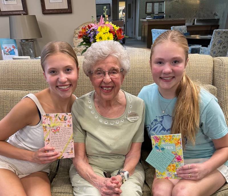 Pen pals during COVID in 2020, now friends and continuing to send letters are Madeline Barr, 18, (left), Helen Meints, 91, and Ann Barr, 15. Meints lives at senior living facility GreenFields of Geneva. The pen pal program started to ease the residents' isolation, but continued as the sisters and Meints continue to write.