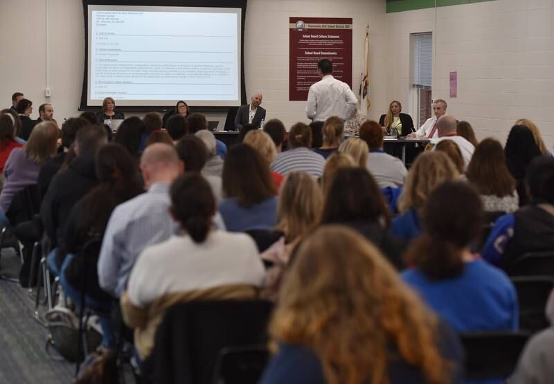 The District 303 School Board listens to English teacher Brian Callahan as he speaks about the involuntary reassignment of himself and several other teachers in the district at Monday’s meeting.