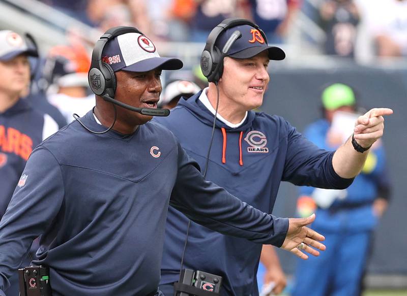 Chicago Bears head coach Matt Eberflus (right) congratulates his team after a touchdown during their game against the Texans Sunday, Sept. 25, 2022, at Soldier Field in Chicago.