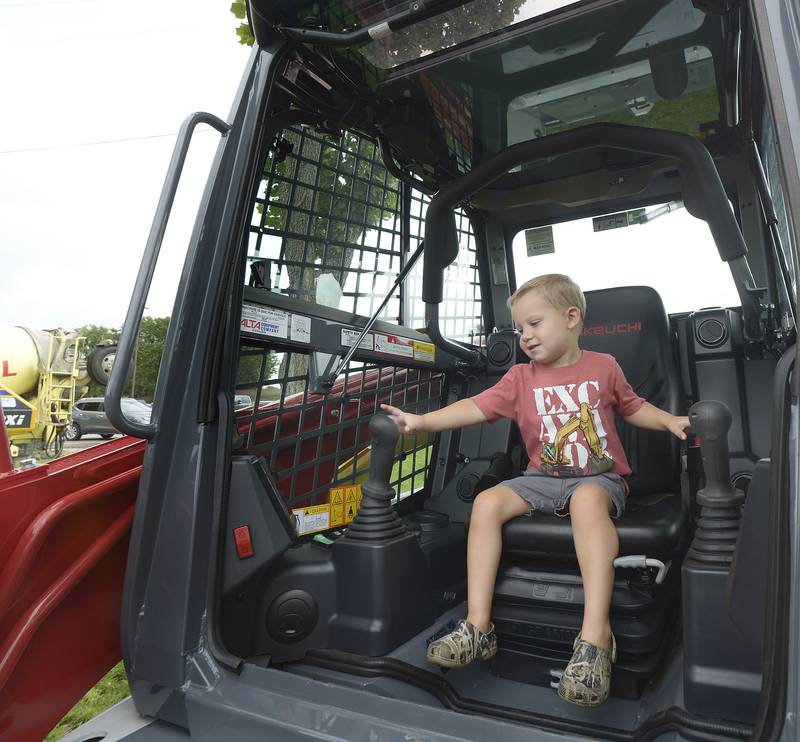 Maxwell Mormann works the levers of this front end loader Sunday, July 28, 2024, during the Touch A Truck event in Ottawa. The event, part of Friendship Days, was sponsored by the Illinois Valley Contractors Association, the Illinois Valley Labor Management Fund and the Illinois Valley Trades.