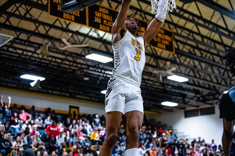 Joliet West's Matthew Moore dunks a shot during a game against Plainfield South Tuesday Feb. 14, 2023 at Joliet West  High School