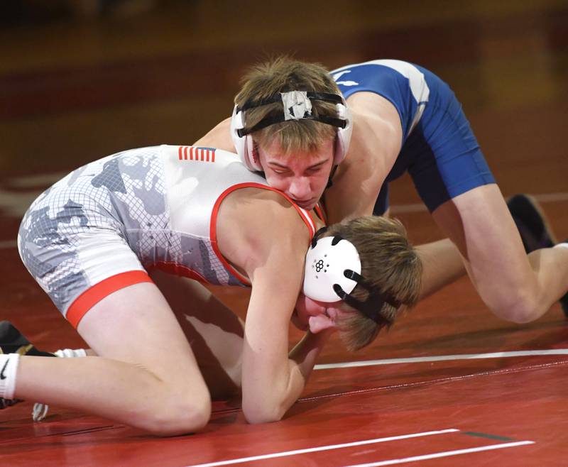 Oregon's Kayden Cover (bottom) wrestles Newman's Tyler Grennan in their 106-pound match at the Oregon Quad meet on Saturday, Jan. 17, 2026 at the Blackhawk Center in Oregon.