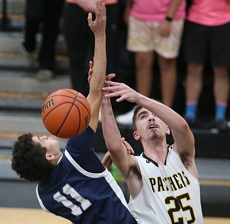 Fieldcrest's Jozia Johnson and Putnam County's Wyatt Grimshaw miss a rebound on Tuesday, Feb. 7, 2023 at Putnam County High School.