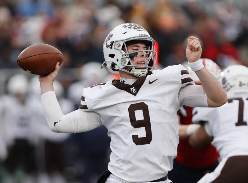 Mt. Carmel's Jack Elliott (9) gets set to pass during the class 7A semi-final playoff game between Mt. Carmel and St. Rita high schools on Saturday, Nov. 23, 2024 in Chicago.