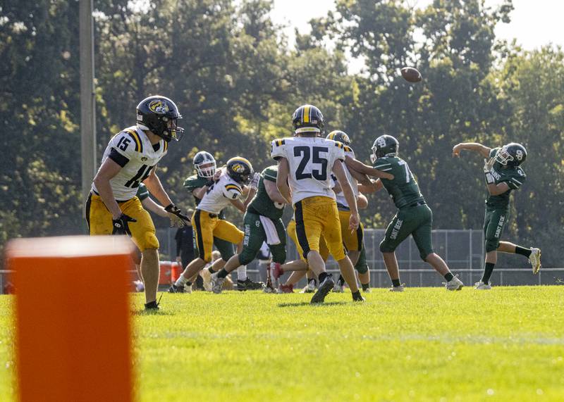 St. Bede Academy quarterback Max Bray throws a touchdown pass against the Elmwood Park Tigers on September 30, 2023.