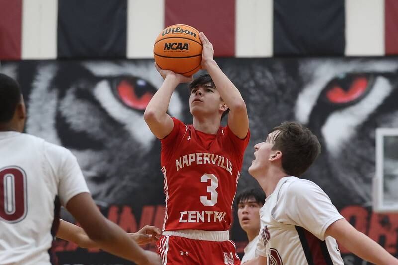 Naperville Central’s Preston Kuta takes the deep shot against Plainfield North on Wednesday, Jan 22, 2025 in Plainfield.