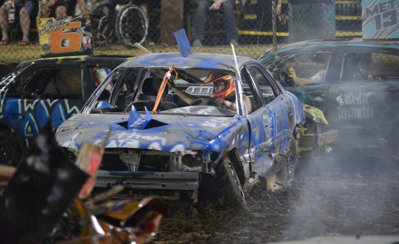 Ethan Bocker, of Forreston, takes a hit in his car (51) in the Compact Heat during the Ogle County Fair's demolition derby on Saturday, Aug. 2, 2025.