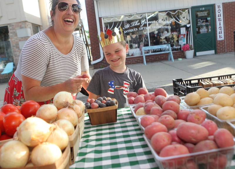 Bonnie McCleese, of Wauconda shares a laugh with her son, Carson, 6, as they check out the potatoes at the Harms Farm produce stand at the Wauconda Farmers’ Market in downtown Wauconda. The farmers’ market runs on Thursday afternoons from 4-7pm through September 29th.