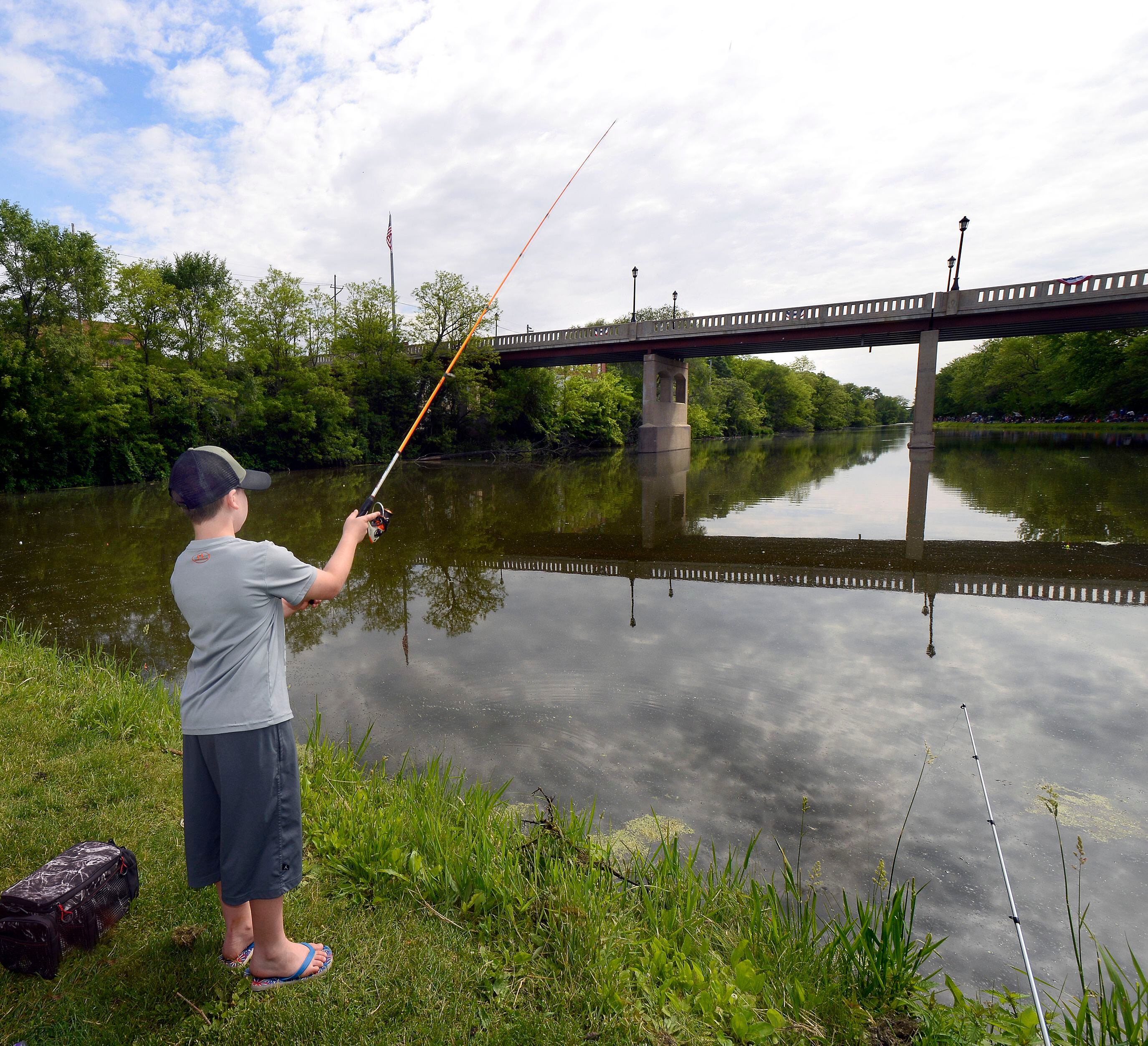 Landon Gleason finds a picturesque spot to try his luck during the 2022 Kids Fishing Tournament at Lock 14 in La Salle.