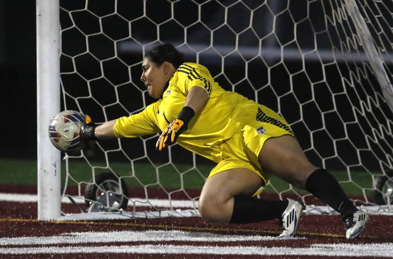 Harvard's Jarithsie Mercado tries to block a penalty kick during the Kishwaukee River Conference Girls Soccer Tournament Championship Match against Richmond-Burton on Wednesday, May 7, 2025, at HRichmond-Burton High School in Richmond.