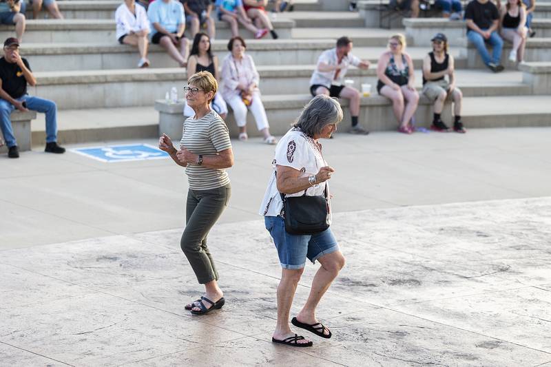 People dance to the music of local rock band The Solution Thursday, June 19, 2025, during the Rock Falls Block Party.