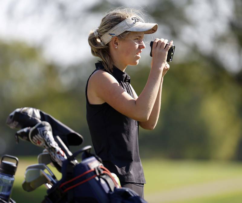 Audrey Wake of Benet Academy, checks her yardage during the IHSA Class 2A West Chicago girls golf regional at St. Andrews Tuesday, Oct. 1, 2024 in West Chicago.