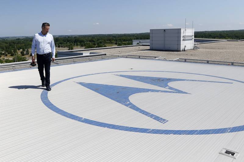 Green Data Center Real Estate Inc. CEO Jason Bak walks around the Motorola logo adorning the helipad atop the property at the former Motorola headquarters on Thursday, June 10, 2021 in Harvard.