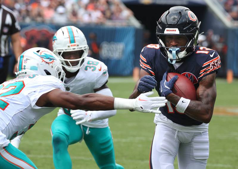 Chicago Bears wide receiver Maurice Alexander puts a move on Miami Dolphins safety Patrick McMorris Sunday, Aug. 10, 2025, during their preseason game at Soldier Field in Chicago.