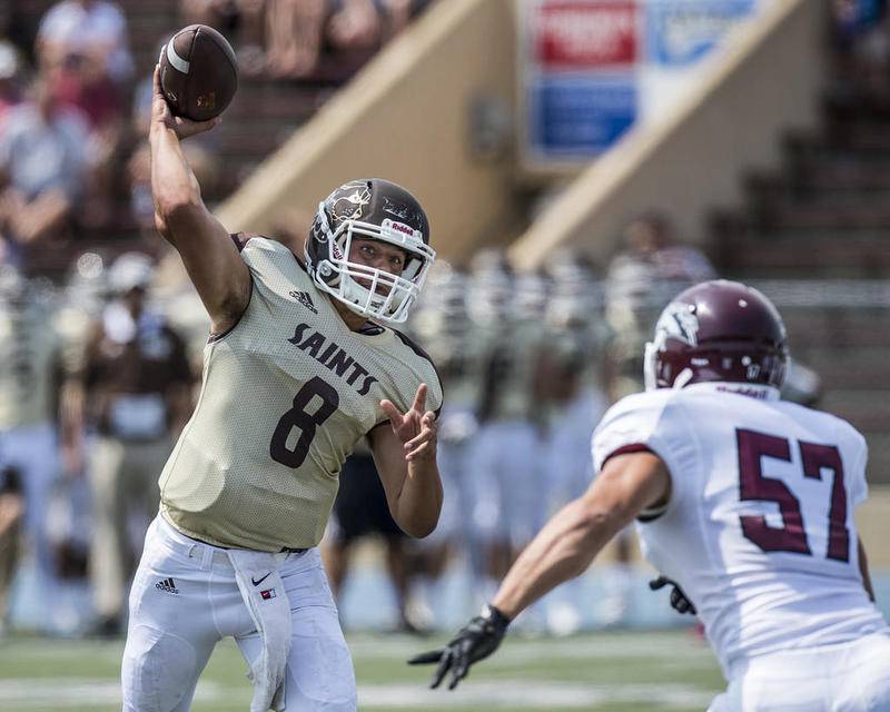 St. Francis quarterback Don Butkus (8) throws the ball for a touchdown during Saturday's game against Morningside College at Joliet Memorial Stadium.