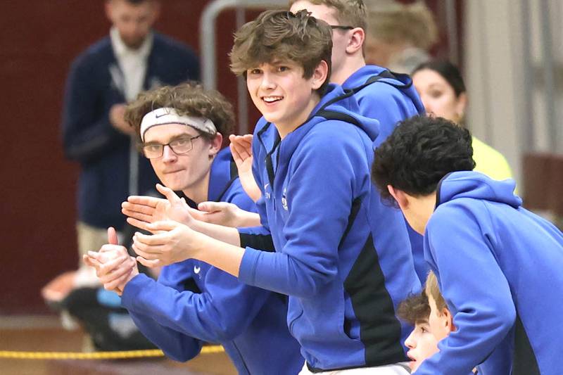 Hinckley-Big Rock's bench celebrates a big shot Wednesday, March 1, 2023, during their Class 1A sectional semifinal matchup with Chicago Marshall at Elgin High School.