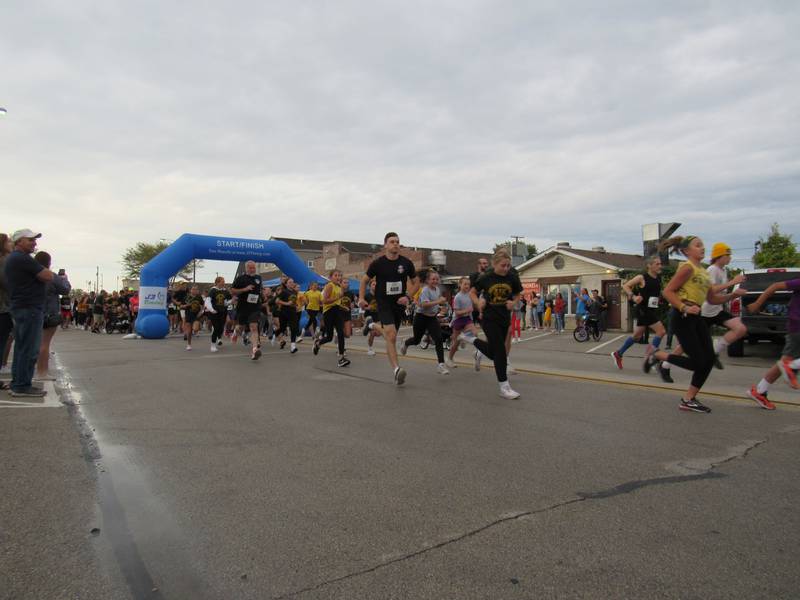 Racers take off from the starting line during the Megan's Mission 5K on Saturday.
