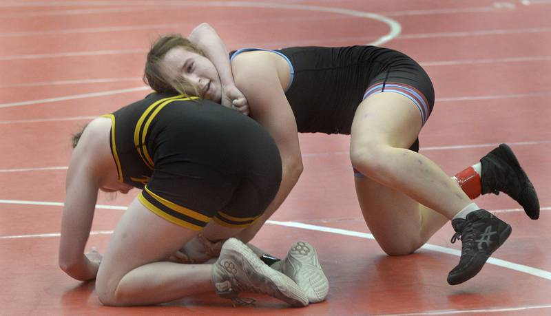 Ottawa's Ava Weatherford battles against Glenbard North's Suzanne Stally in an Elite Bracket 140-pound bout at Monday's Ottawa Holiday Hootenanny Invite in Kingman Gymnasium.