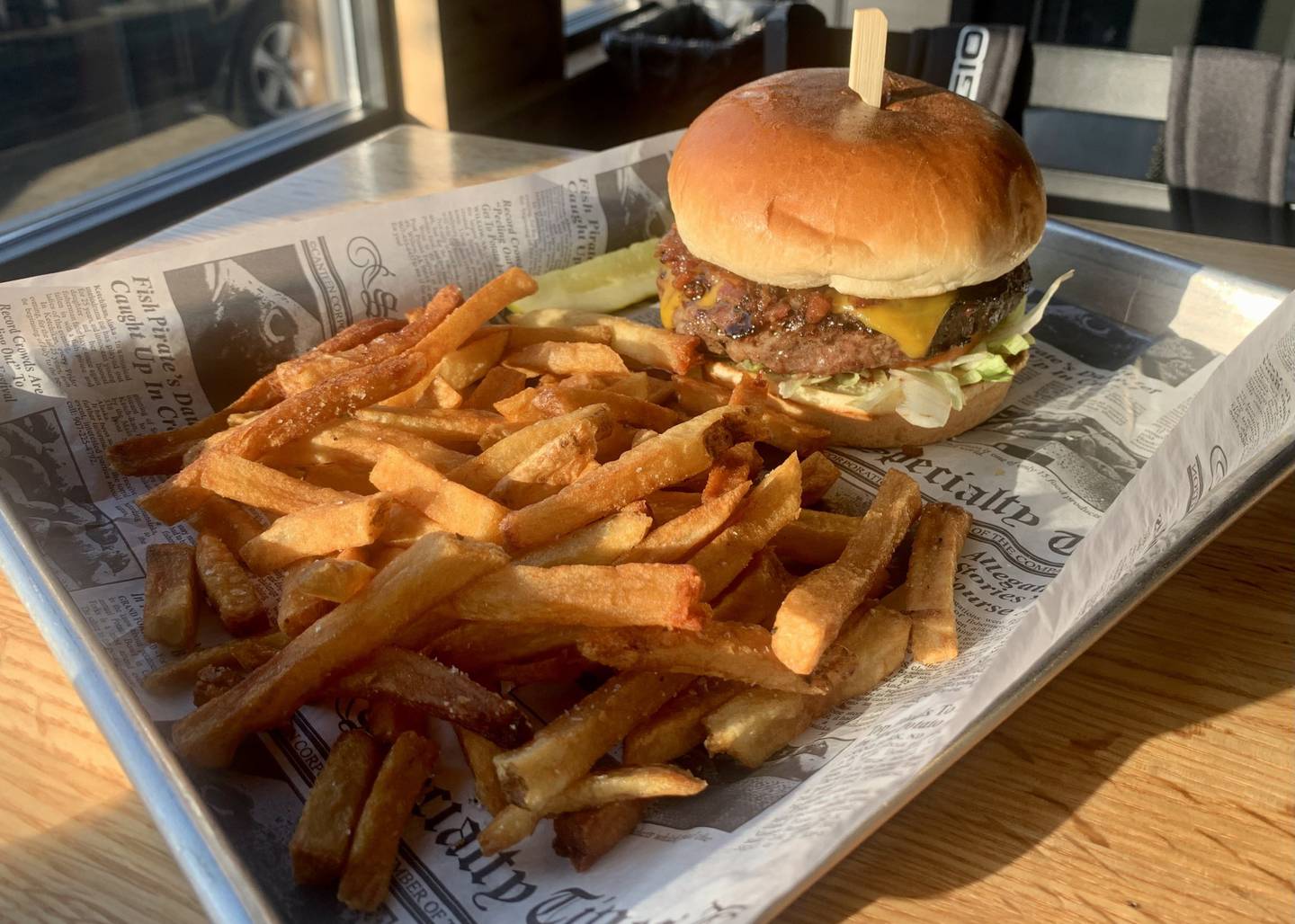 Bacon Jam Burger with a side of fries at Duke's Northwoods in St. Charles.