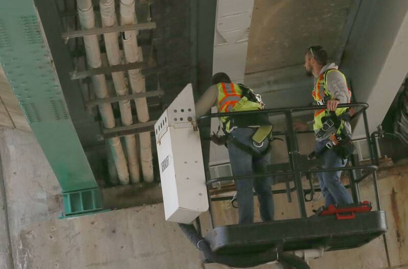 Illinois Department of Transportation crews inspect the 7th Street bridge over Illinois Route 251 after a semi struck it on Monday, March 10, 2025 in Peru. The semi was hauling two clamshell bucket for excavating equipment.