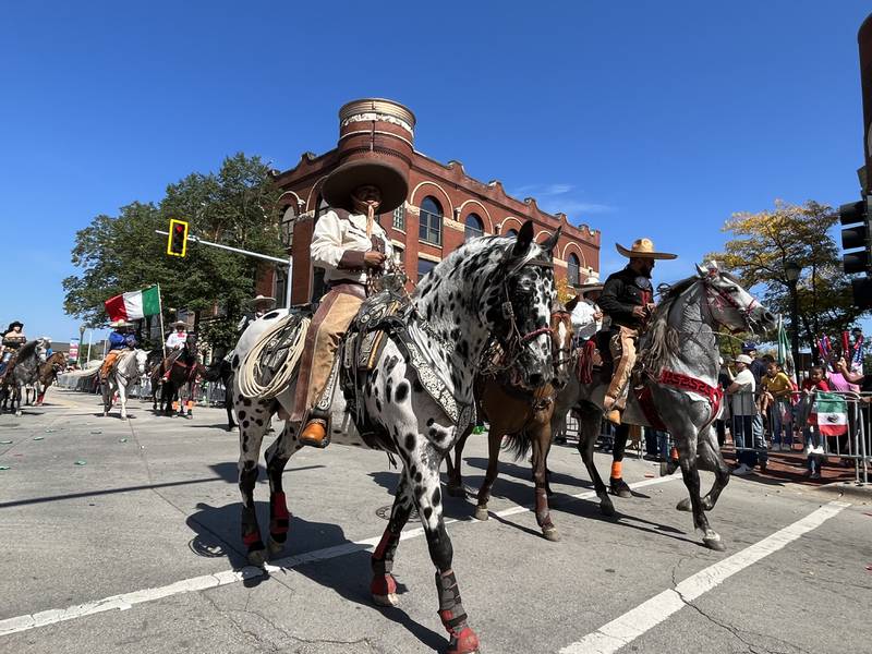 Horse riders participating in the 60th annual Mexican Independence Day parade on Saturday, Sept. 23, 2023, in downtown Joliet.