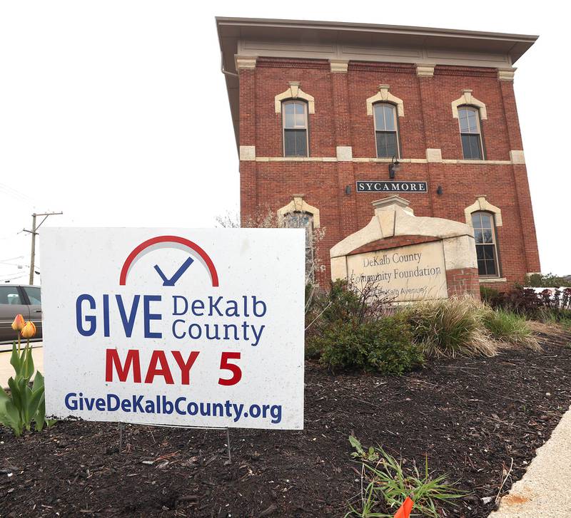 Signs outside of the DeKalb County Community Foundation in Sycamore Tuesday, May 3, 2022, remind people to be generous during Give DeKalb County.