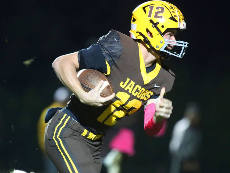 Jacobs’ Connor Goehring runs the ball for a successful two-point conversion against Dundee-Crown in varsity football  at Jacobs High School in Algonquin on Friday, Oct. 10, 2025.