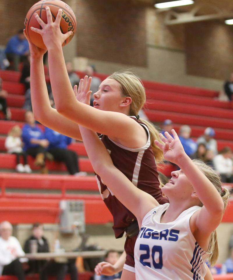 Morris's Landrie Callahan grabs a rebound over Princeton's Reese Reviglio during the Lady Pirate Holiday Tournament on Wednesday, Dec. 20, 2023 in Kingman Gym.