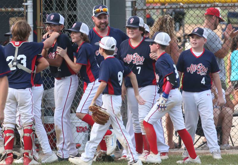 Members of the Streator 11-12 year old all star team react after defeating Ottawa American 5-0 on Sunday, July 14, 2024 at Washington Park in Peru.
