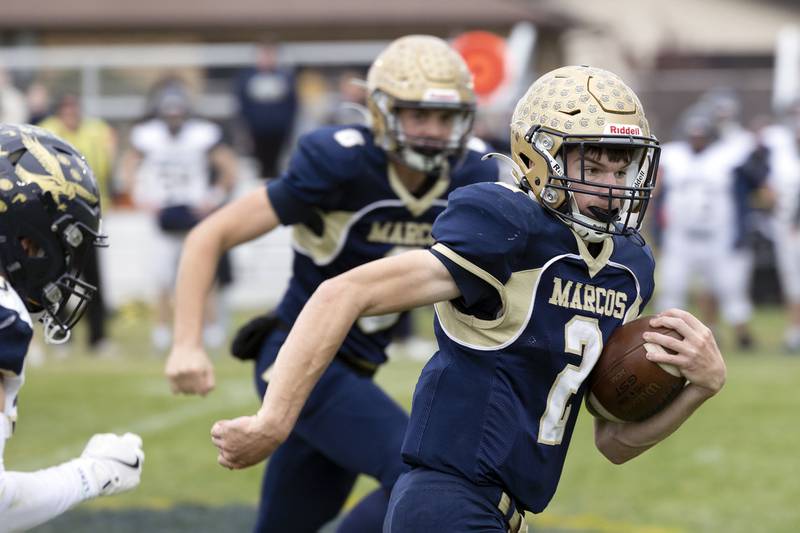 Polo’s JT Stephenson runs for yards against Hiawatha Saturday, Nov. 1, 2025, in the 8-man football playoff quarterfinals.
