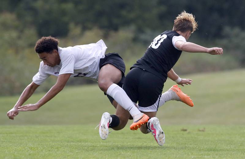 Hampshire's Evan Amagasse and Prairie Ridge's Mason Fowler get tangled up during a Fox Valley Conference soccer match Tuesday, Sept. 19, 2023, at Prairie Ridge High School in Crystal Lake.