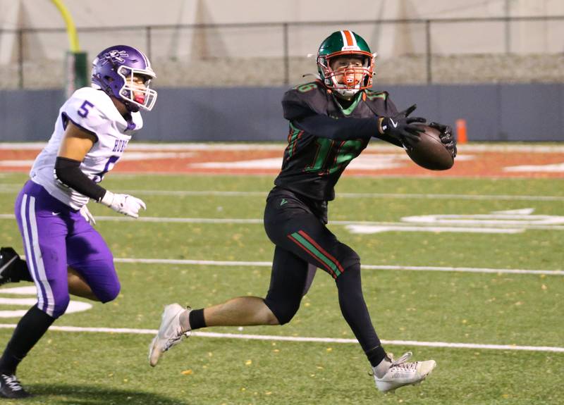 L-P's Wyatt Kilday makes a catch over Rochelle's Elija Harley on Friday, Sept. 27, 2024 at Howard Fellows Stadium.
