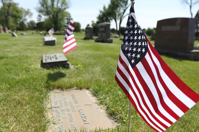 American flags mark the graves of veterans at the Fairview Cemetery in DeKalb for Memorial Day weekend.