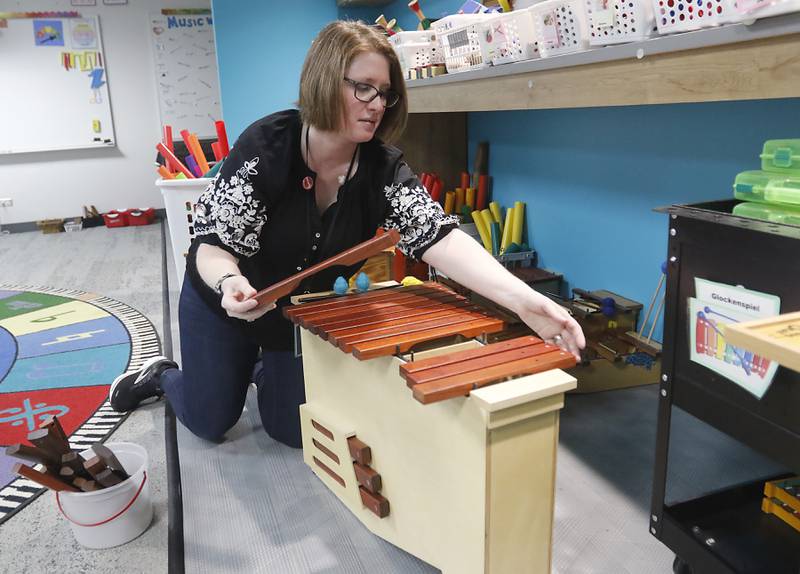 Music teacher Kathleen Choi with some of the music instruments that she was able to get donated to the Algonquin Road Elementary School in Fox River Grove, on Thursday, April 20, 2023.