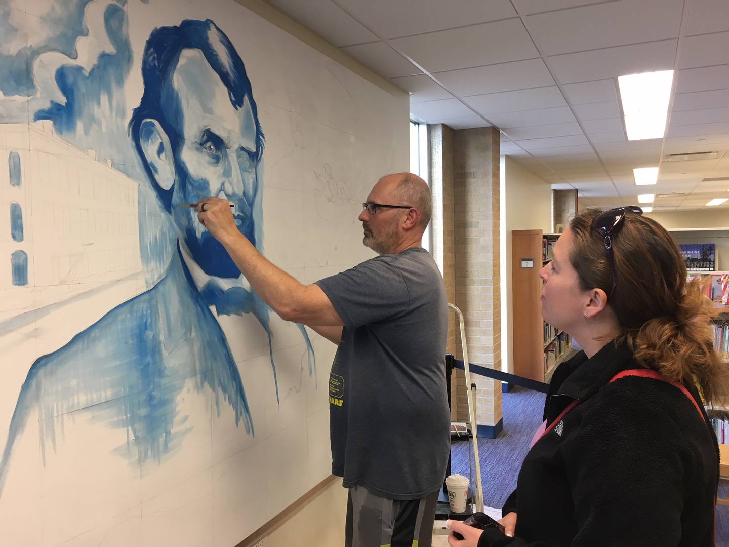 In June 2018, Plainfield artist John McDavitt hosted community paint days at the White Oak Library District, Lockport branch. At the time, McDavitt was creating a mural inside the library and had invited the public to help paint it. The mural joins together themes of Abraham Lincoln, the I&M Canal and early explorers.