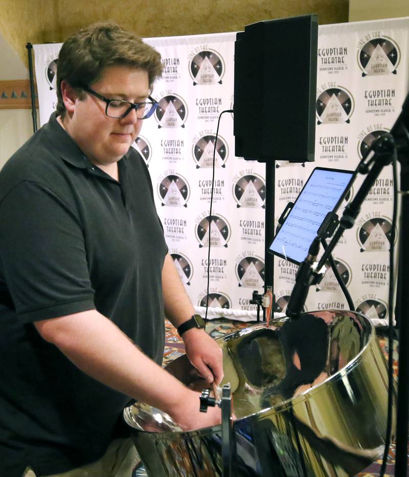 Matthew Kiser provides the entertainment playing the steel pan Thursday, April 18, 2024, during Earth Fest at the Egyptian Theatre in DeKalb. The event, in honor of Earth Week, was presented by DeCarbon DeKalb, in partnership with Northern Illinois University.