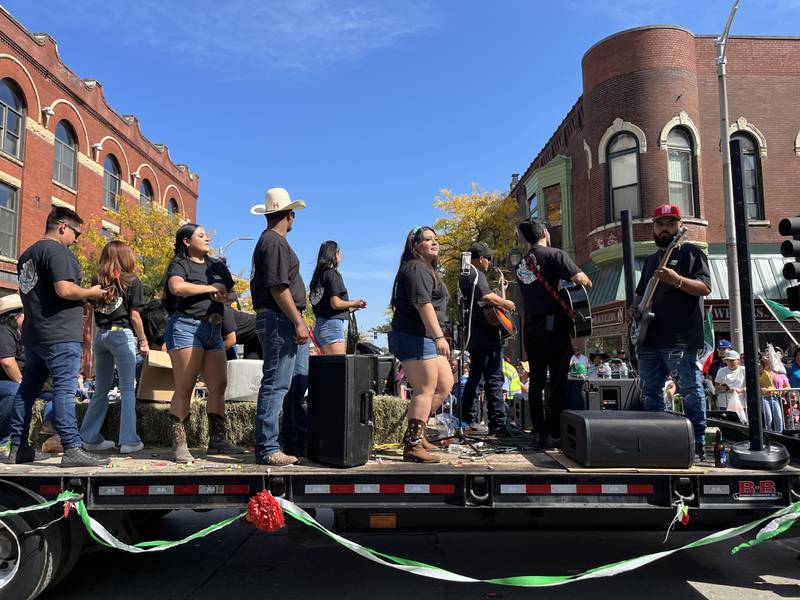 A float featuring musicians and dancers for the 60th annual Mexican Independence Day parade on Saturday, Sept. 23, 2023, in downtown Joliet.