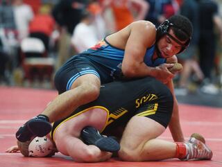 Downers Grove South’s RJ Samuels, top, wrestles Hinsdale South’s Jovani Piazza in a 175-pound bout during semifinals of the Hinsdale Central wrestling tournament on Saturday December 16, 2023 in Hinsdale. (Joe Lewnard/jlewnard@dailyherald.com)