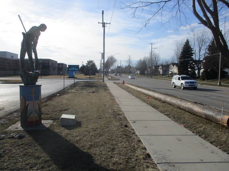 A sculpture outside Troy Middle School in Joliet stands near the western end of the section of Theodore Street that will be widened this year. Feb. 25, 2024.