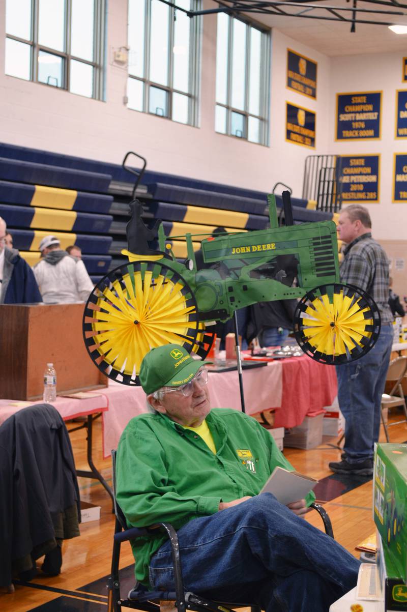 Jim Olsen, of Dixon, sits behind his table at the Polo Lions Club’s 38th Farm Toy Show on March 4. Olsen has collected John Deere memorabilia for 20 years and has more than a dozen antique two-cylinder tractors. The show was held at Polo Community High School.